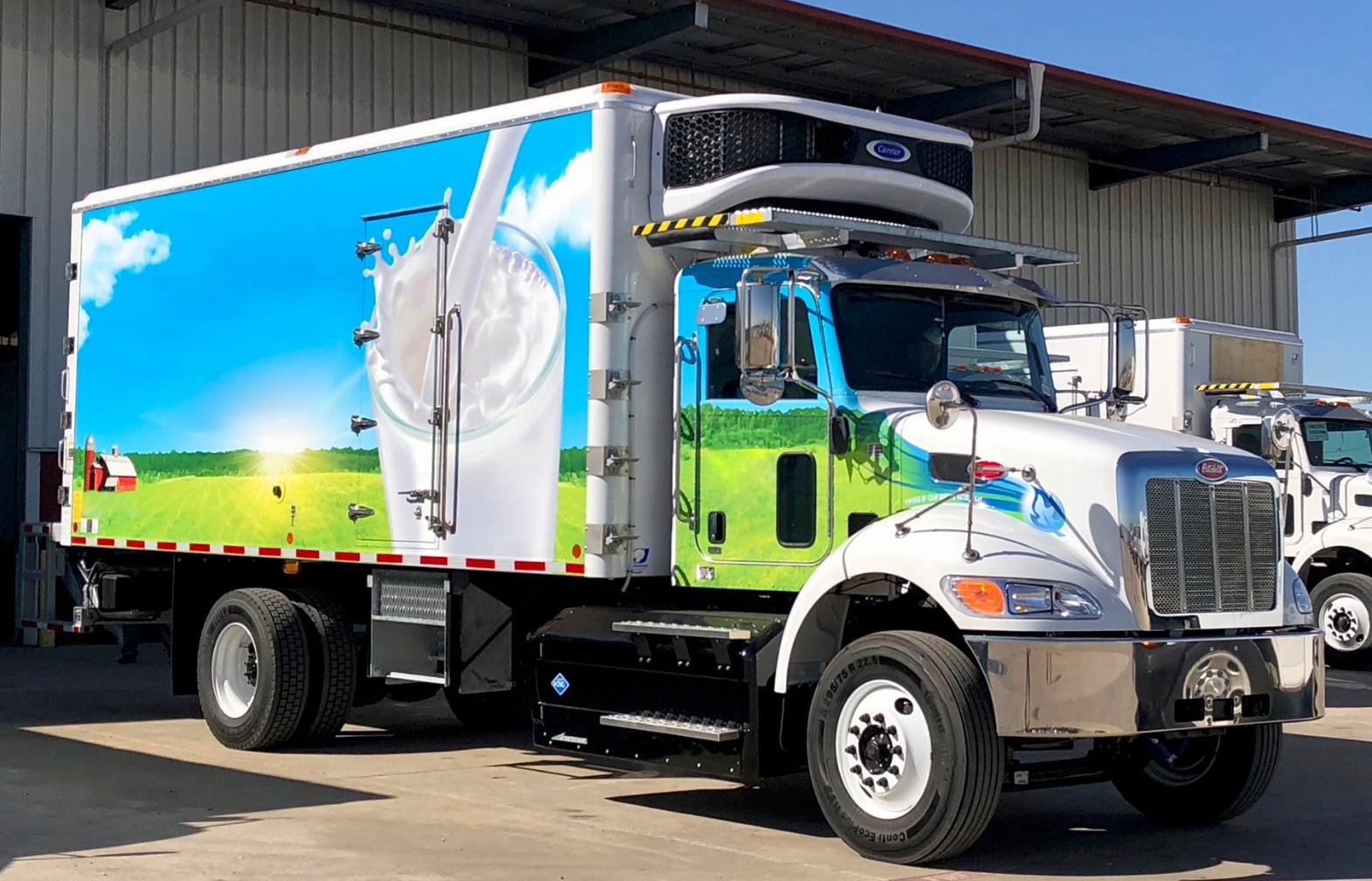 Peterbilt day cab truck with refrigerated body and side mount CNG fuel system