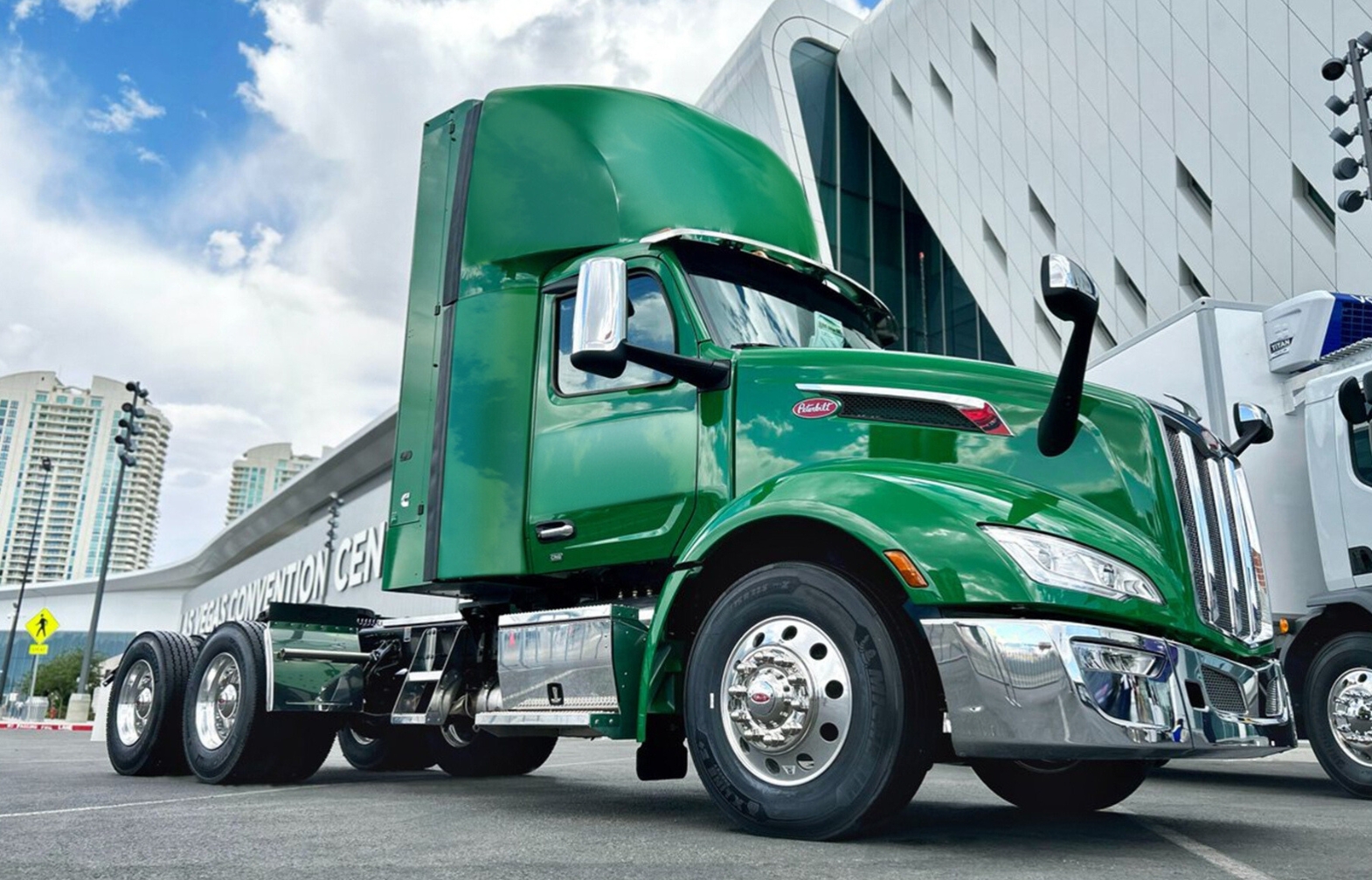 Green Peterbilt day cab truck with back of cab CNG fuel system