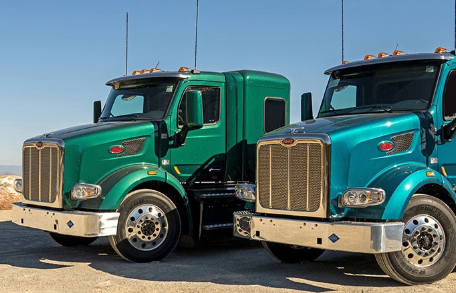 Two Peterbilt trucks with CNG fuel systems